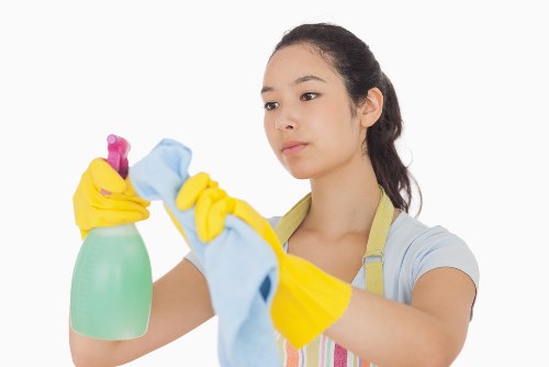 Safety-focused oven cleaning scene with protective equipment