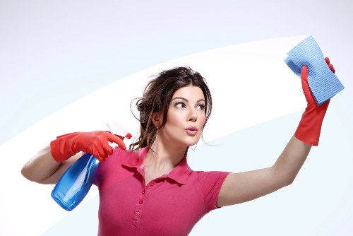Residential cleaner working in a high-rise Canary Wharf flat